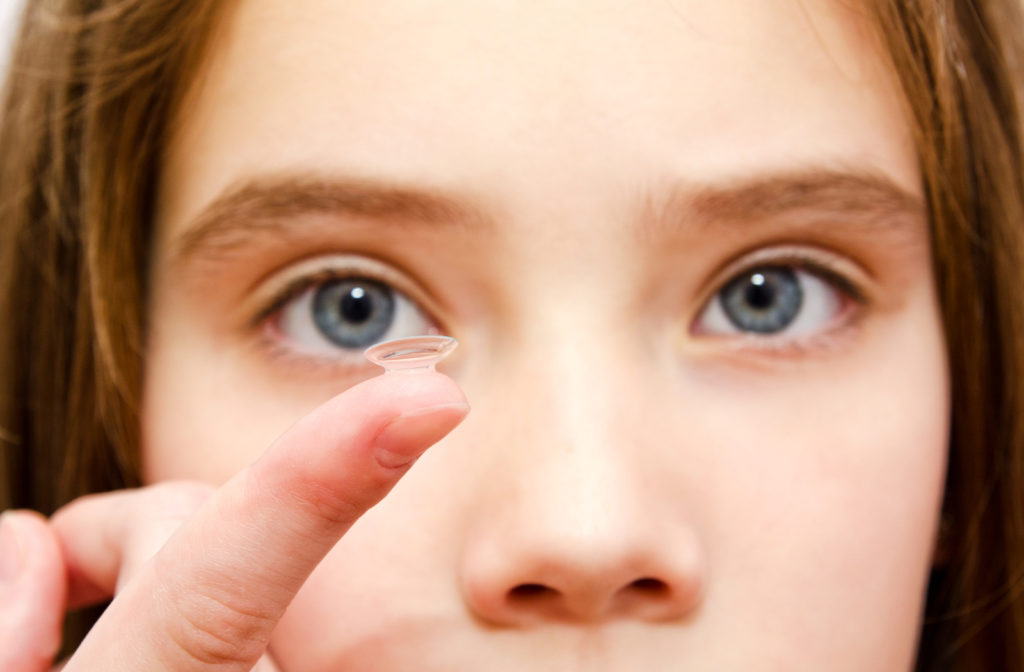 Girl wearing having specialized contact lenses to help with myopia progression