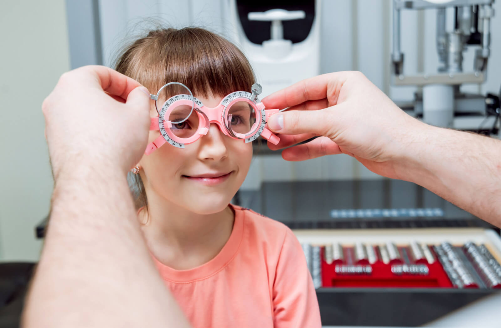 a child has an eye exam to determine if she has myopia