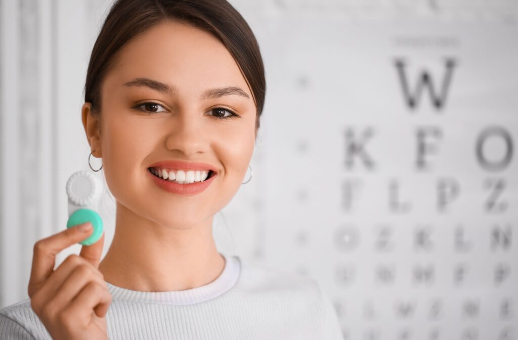 Optometrist holding a contact lens case.